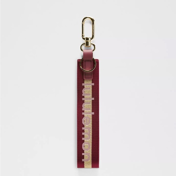 Lululemon Never Lost‎ Keychain Wordmark ColourDeep Luxe/Gold/Bone - Picture 1 of 4